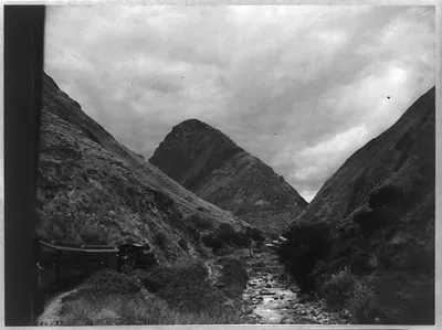 Guayaquil-Quito (Ecuador) Railroad's famous switchback Nariz del Diablo" (Devil's Nose). Train approaching with the Devil's Nose rising in center of picture"