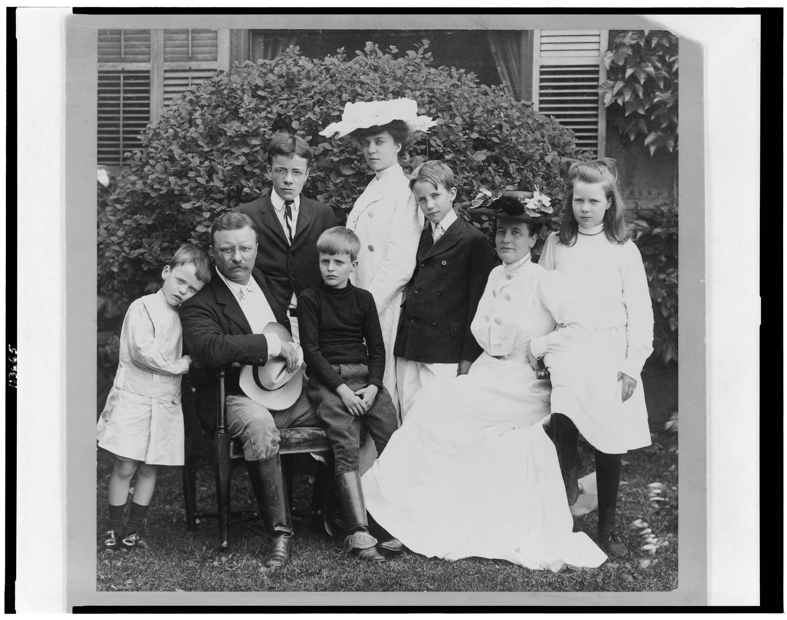 [Pres. and Mrs. Theodore Roosevelt seated on lawn, surrounded by their family], c1903. — historic photograph