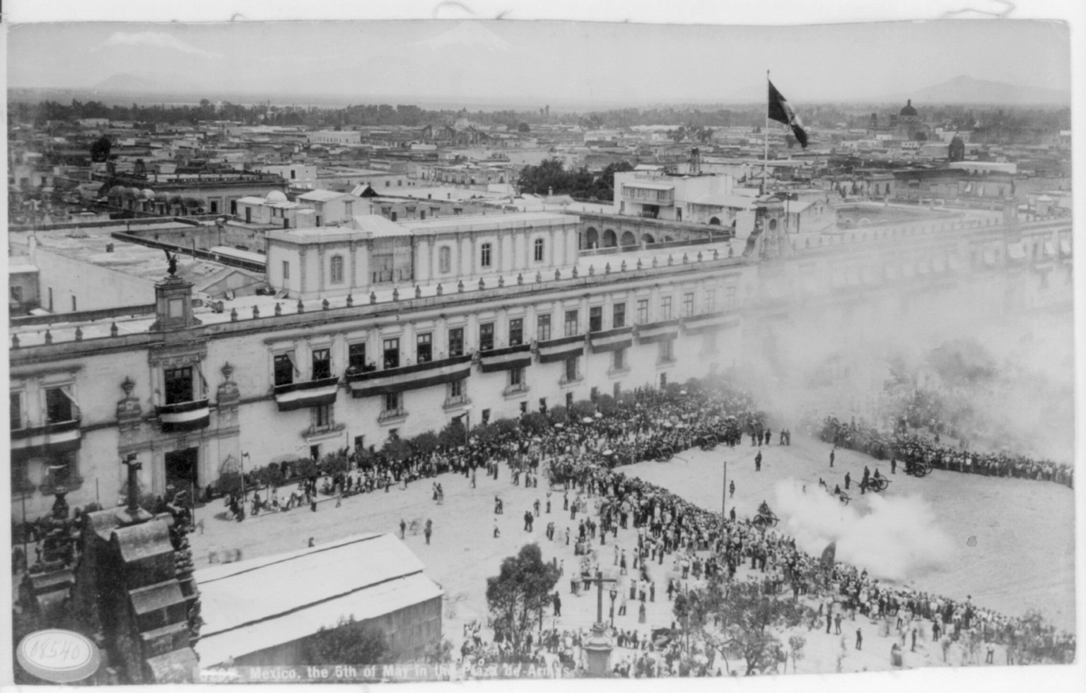 [Mexico - Mexico City, 1884-1885; the 5th of May in the Plaza de Armas" (bird's-eye view ; cannons firing salute amid crowd)]" — historic photograph