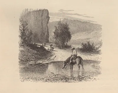 Horseman watering his horse at a rocky river ford
