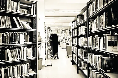 Library bookshelves in a black and white photograph