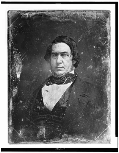Daguerreotype portrait of a bearded man, half-length