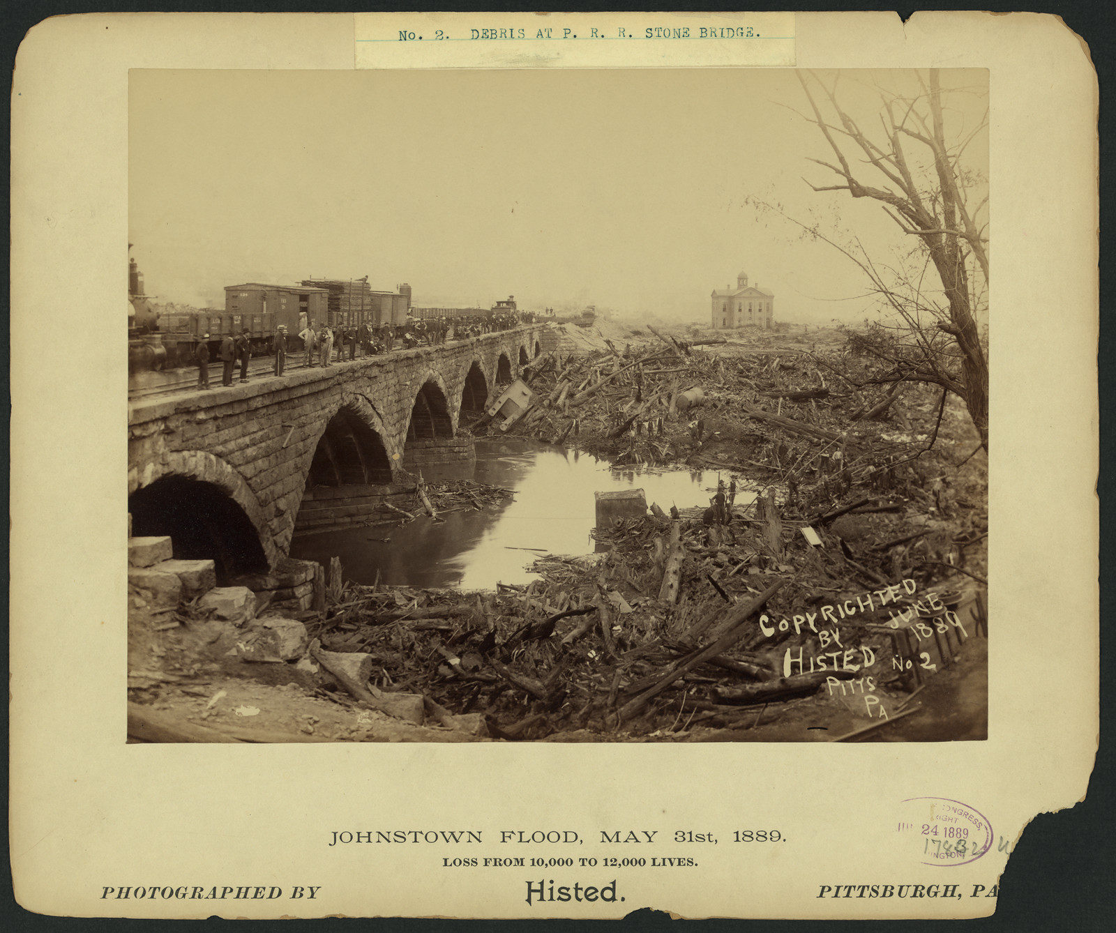 Debris at P.R.R. stone bridge, Johnstown Flood, May 31st, 1889, c1889. — historic photograph