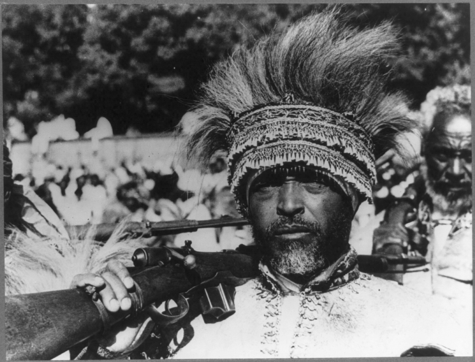 [Addis Ababa, Ethiopia, 1935(?). Close-up of Abyssinian chieftain with rifle on shoulder] — historic photograph
