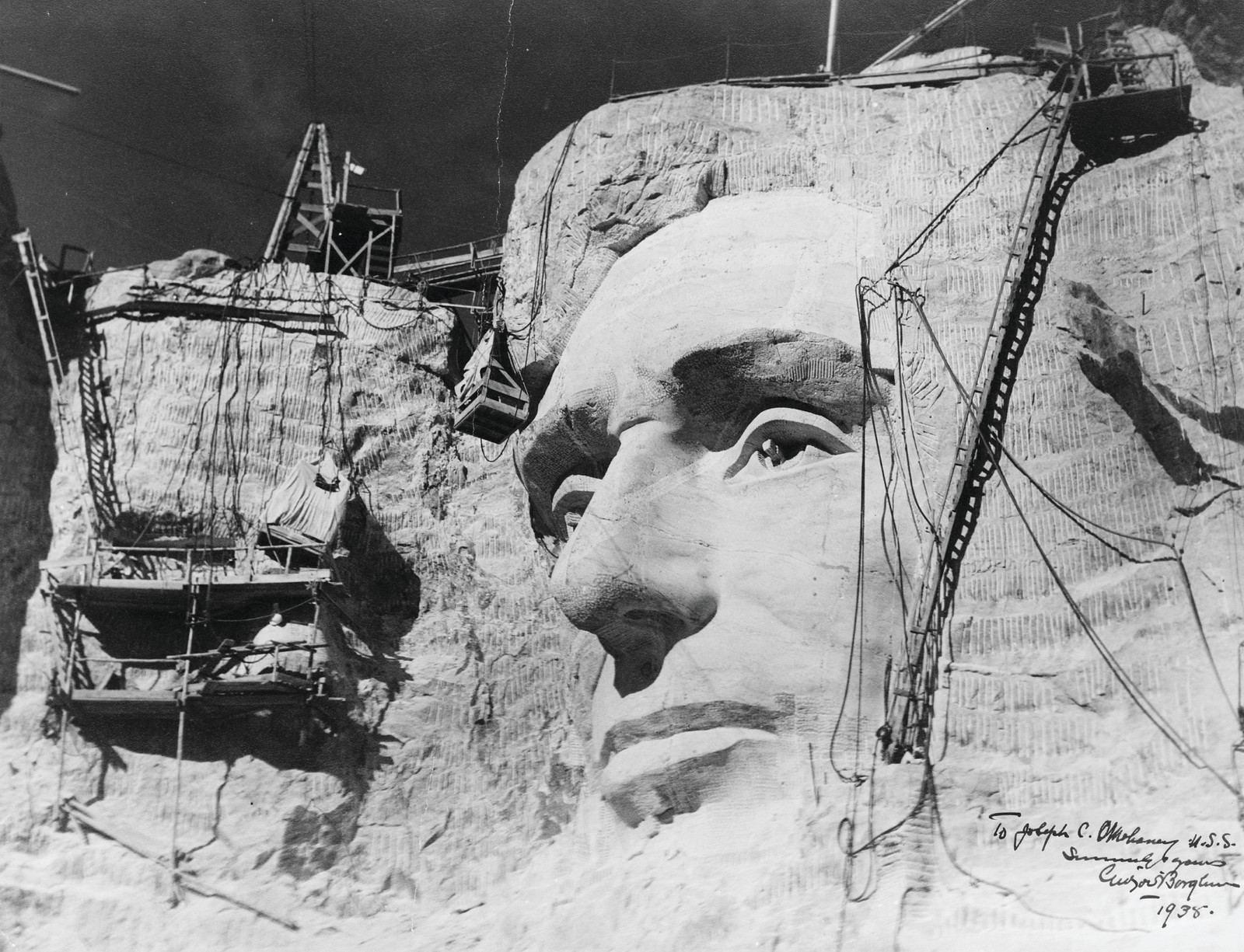 Carving of Abraham Lincoln's face on Mount Rushmore under construction — historic image
