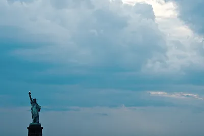 Statue of Liberty against a cloudy sky