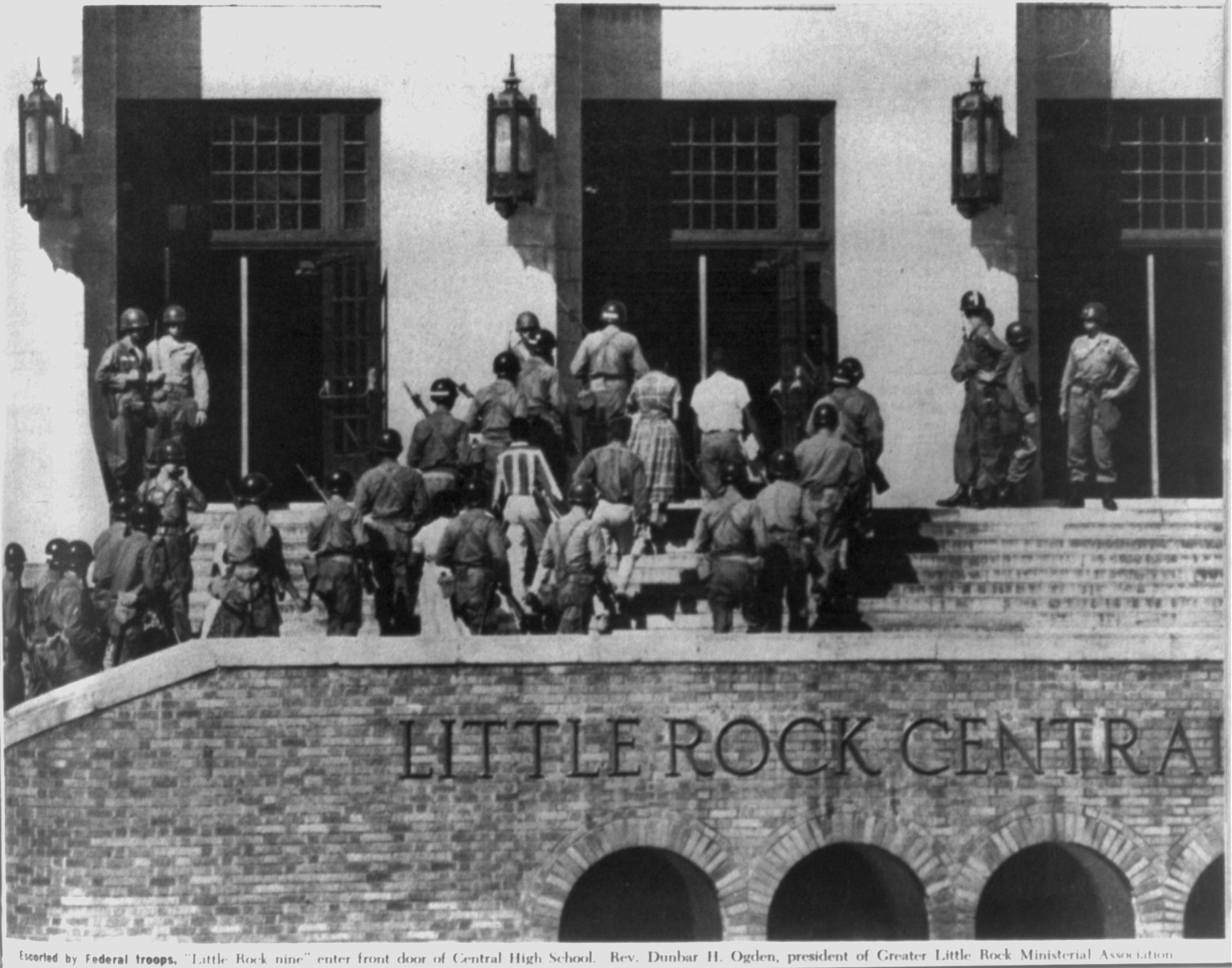 Escorted by Federal troops, Little Rock nine" enter front door of Central High School", 1958 Jan. — historic print