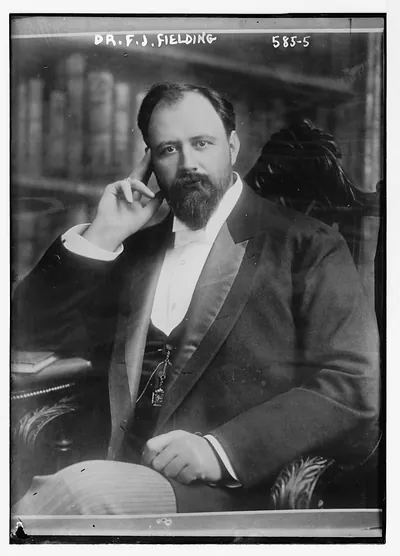 Dr. F.J. Fielding, seated