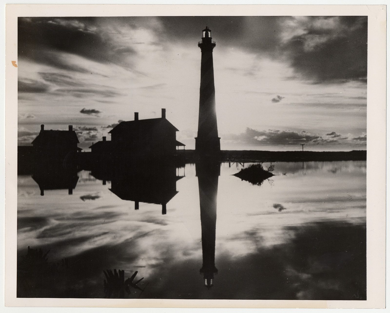 Historic old lighthouse mirrored in a pool — historic photograph