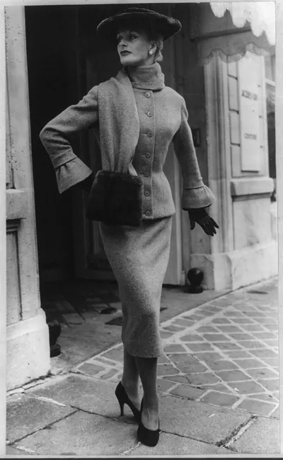 [Woman modeling Fath suit with funnel cuffs and large beaver hat]