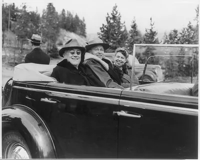 [Franklin Delano Roosevelt, 1882-1945, in open car with Eleanor and Yellowstone Park official]