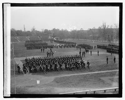 [Unidentified uniformed men participating in ceremony]