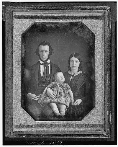 [Adams family portrait, with man, woman, and baby girl]