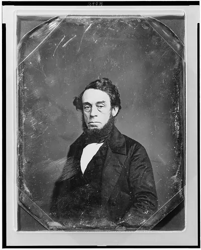 Daguerreotype portrait of a bearded man, half-length