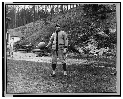[Ed Konetchy, baseball player with the Pittsburgh Pirates, standing, while holding a basketball]