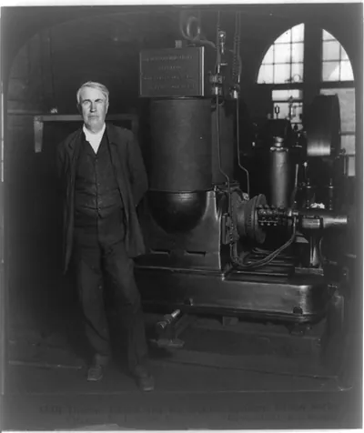 Thomas Edison and his original dynamo, Edison Works, Orange, N.J., U.S.A.
