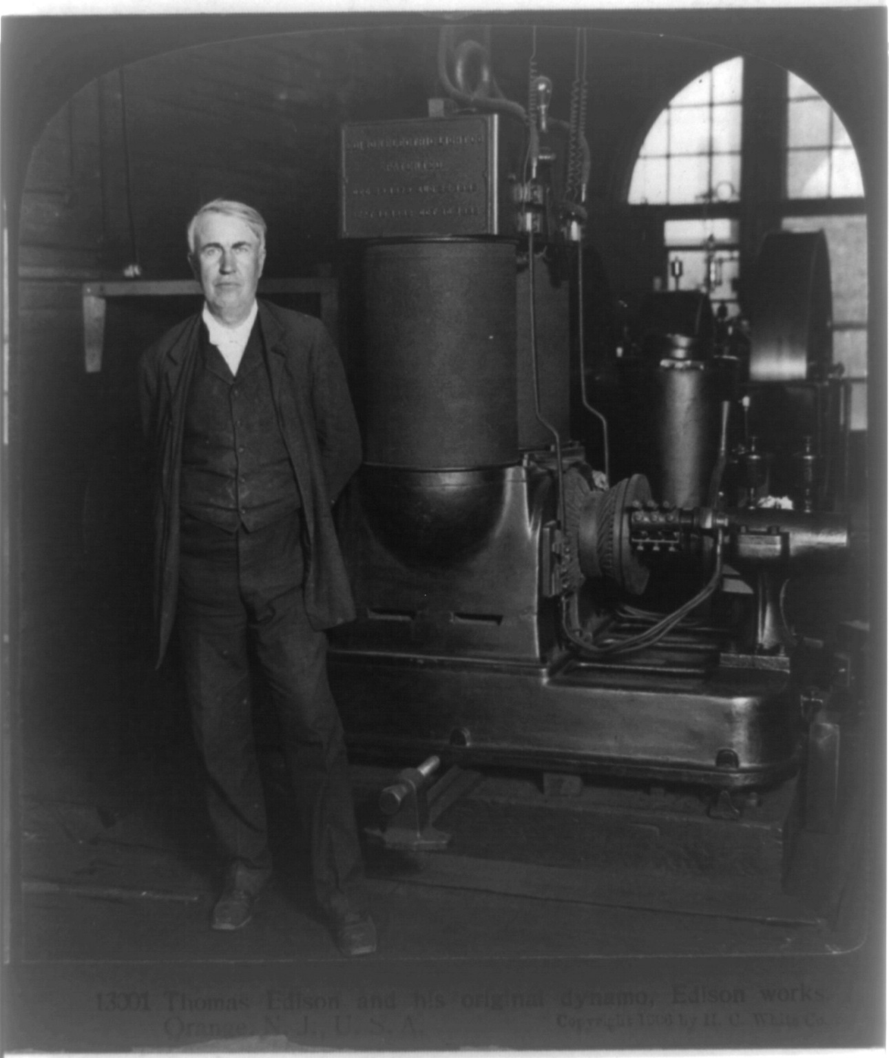 Thomas Edison and his original dynamo, Edison Works, Orange, N.J., U.S.A., c1906. — historic photograph