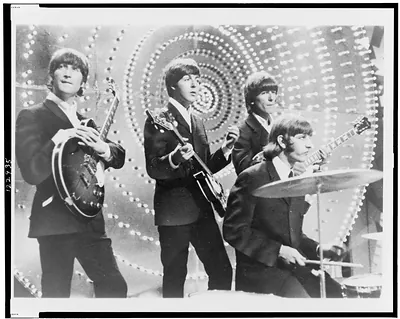 [The Beatles performing on stage]