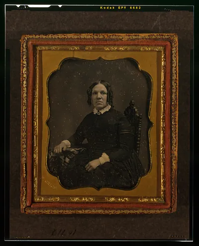Seated unidentified woman in ornate daguerreotype case