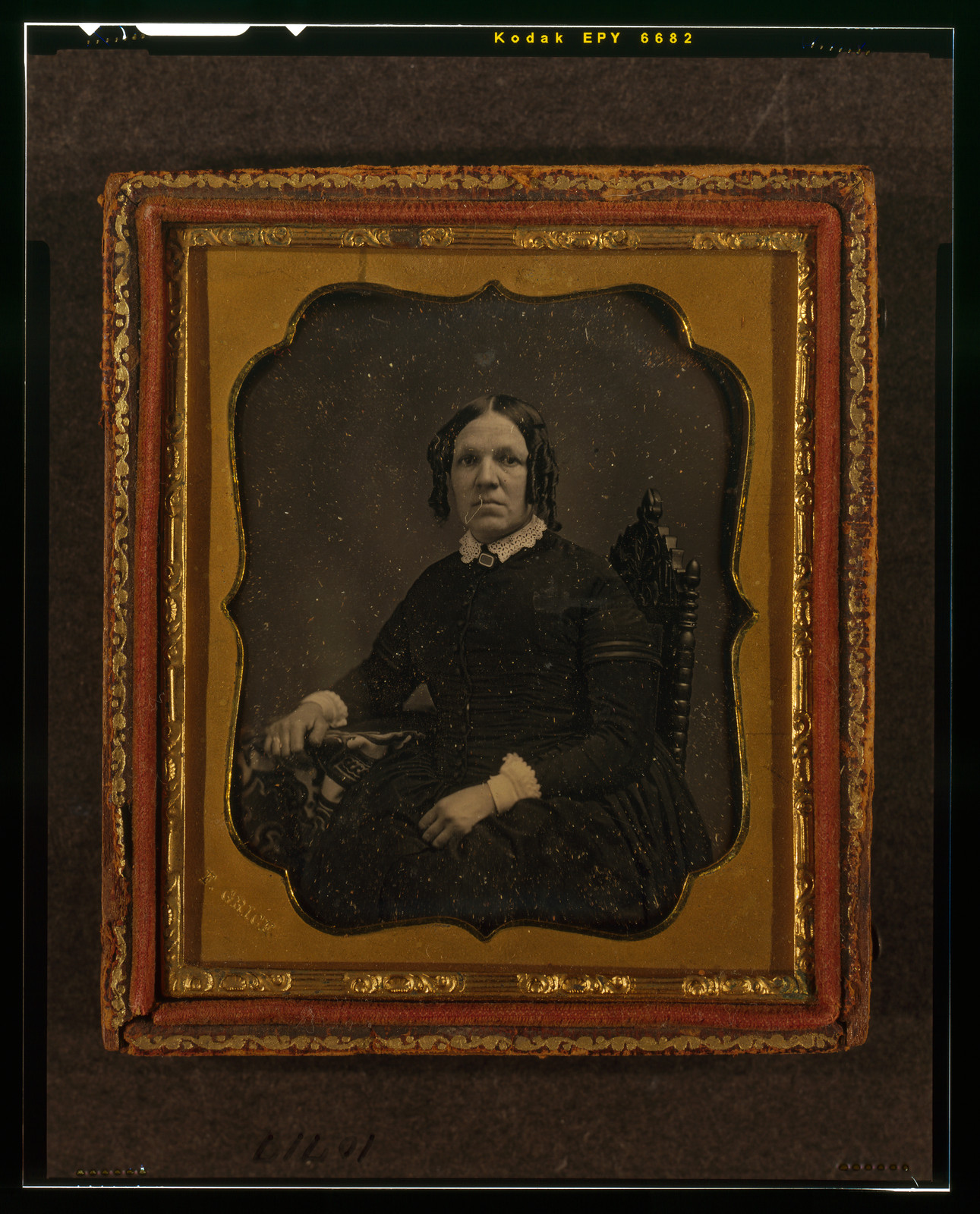 Seated unidentified woman in ornate daguerreotype case, 1855 — historic photograph