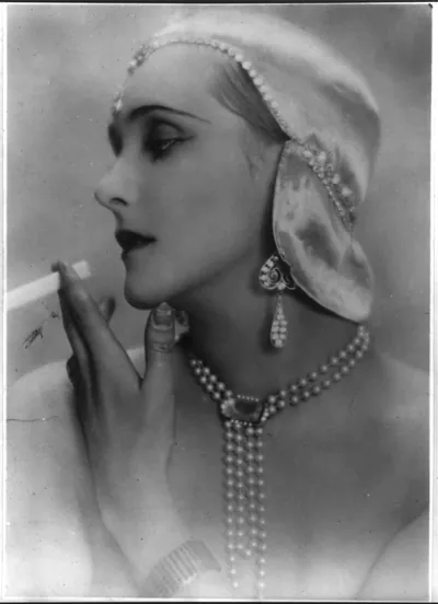 [Baroness Edith von Winterfeld smoking a cigarette; head and shoulders]