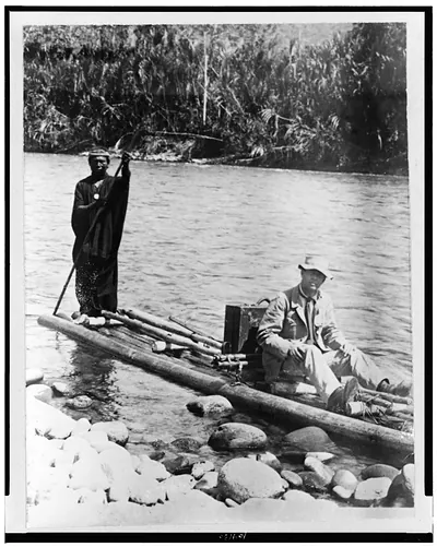 [Explorer, with Indian, on raft, in the Amazon Jungle, South America]