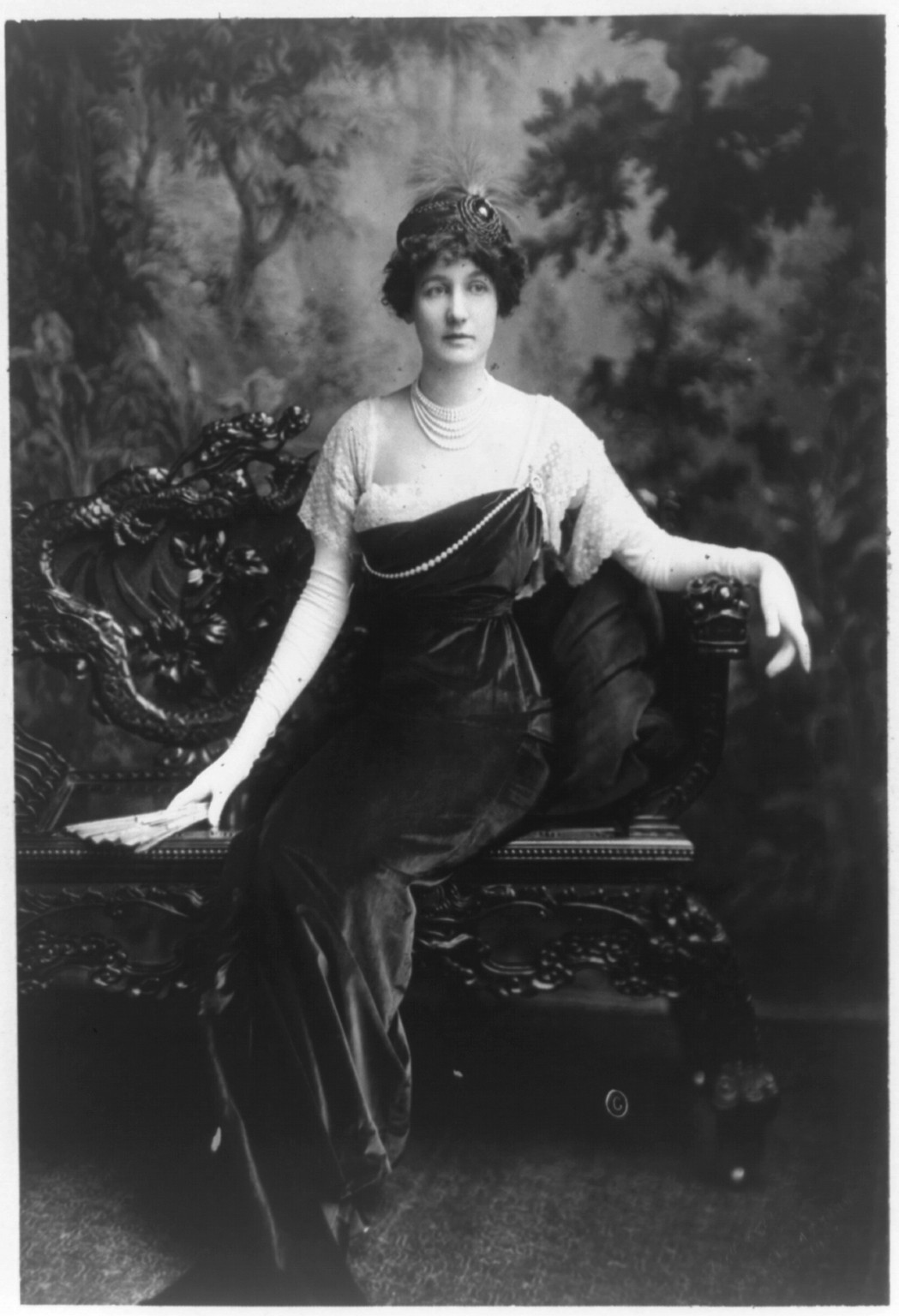 [Mrs. Archer Huntington, full-length portrait, seated, facing right], c1911. — historic photograph