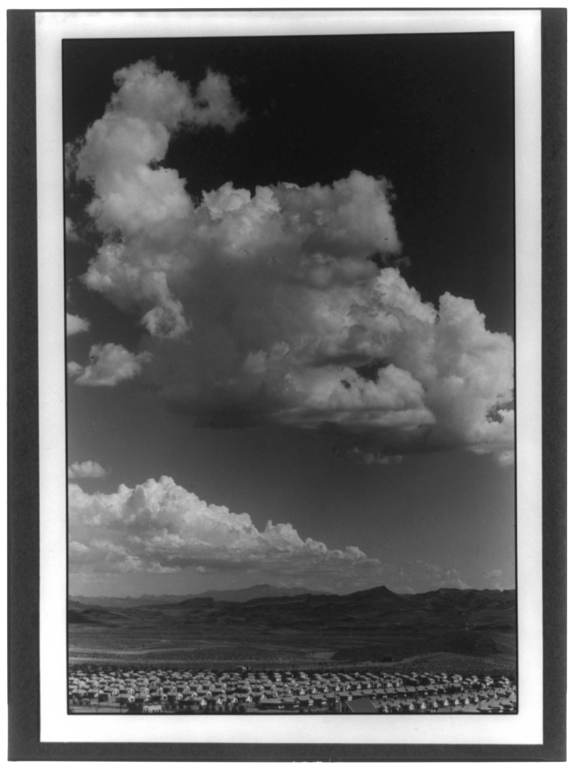 [Boulder City, Nevada--Desert clouds over Boulder City, bird's-eye view], 1934 — historic photograph