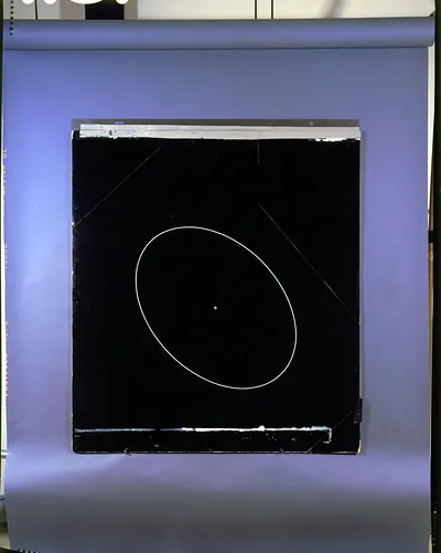 Black board with white elliptical orbit diagram