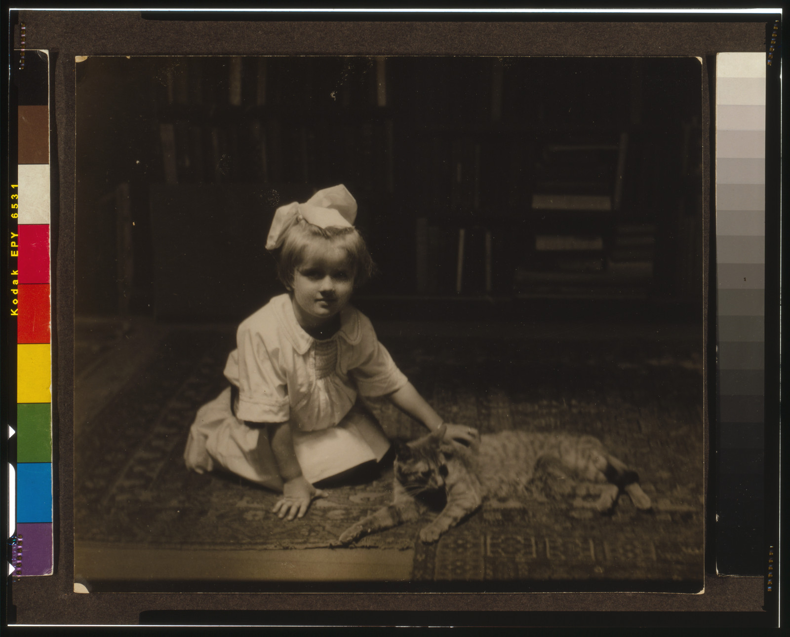 [Barbara Newberry with Buzzer the cat], [1915?] — historic photograph