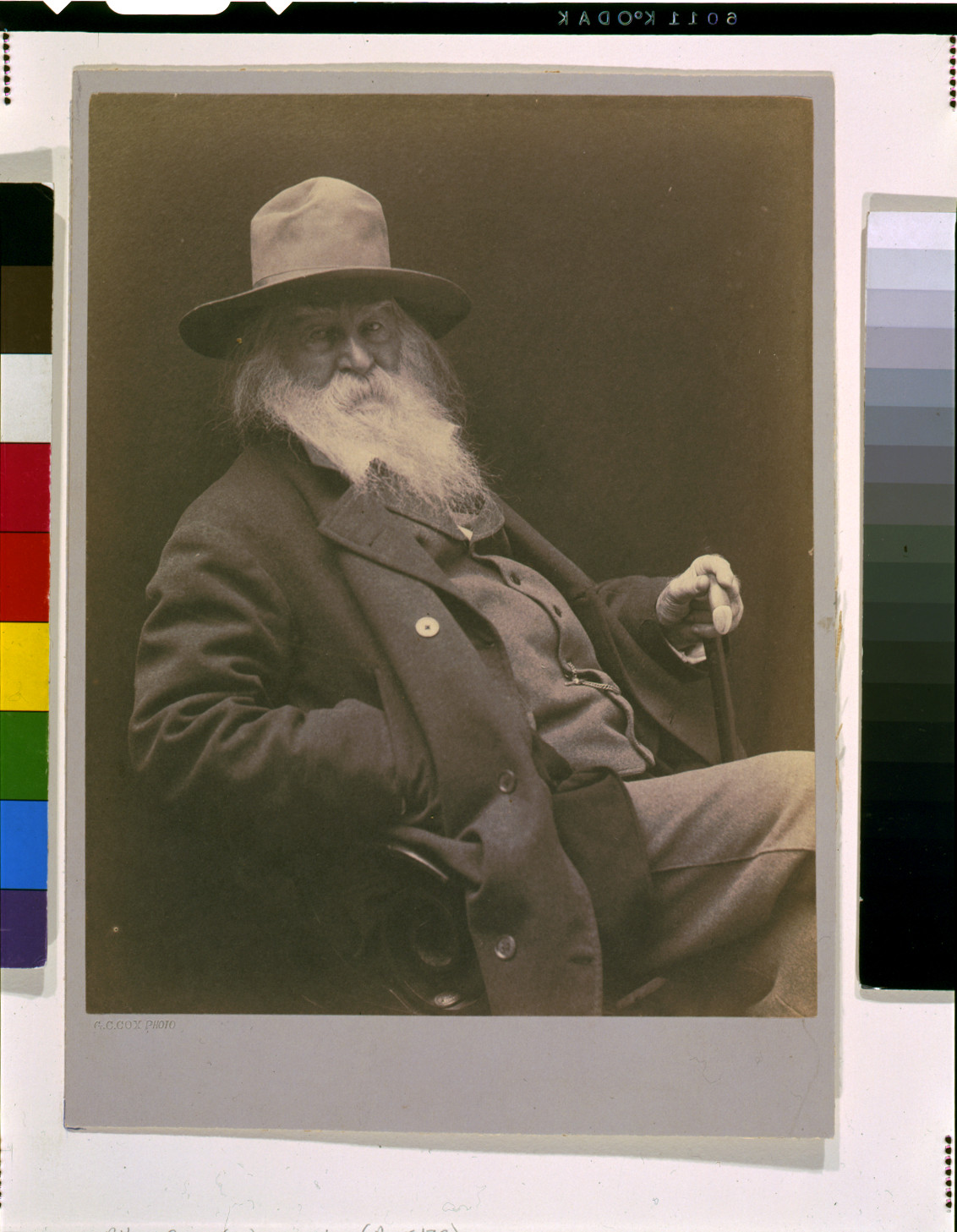 [Walt Whitman, three-quarter length portrait, seated, facing right, wearing hat] / G.C. Cox photo., c1887. — historic photograph