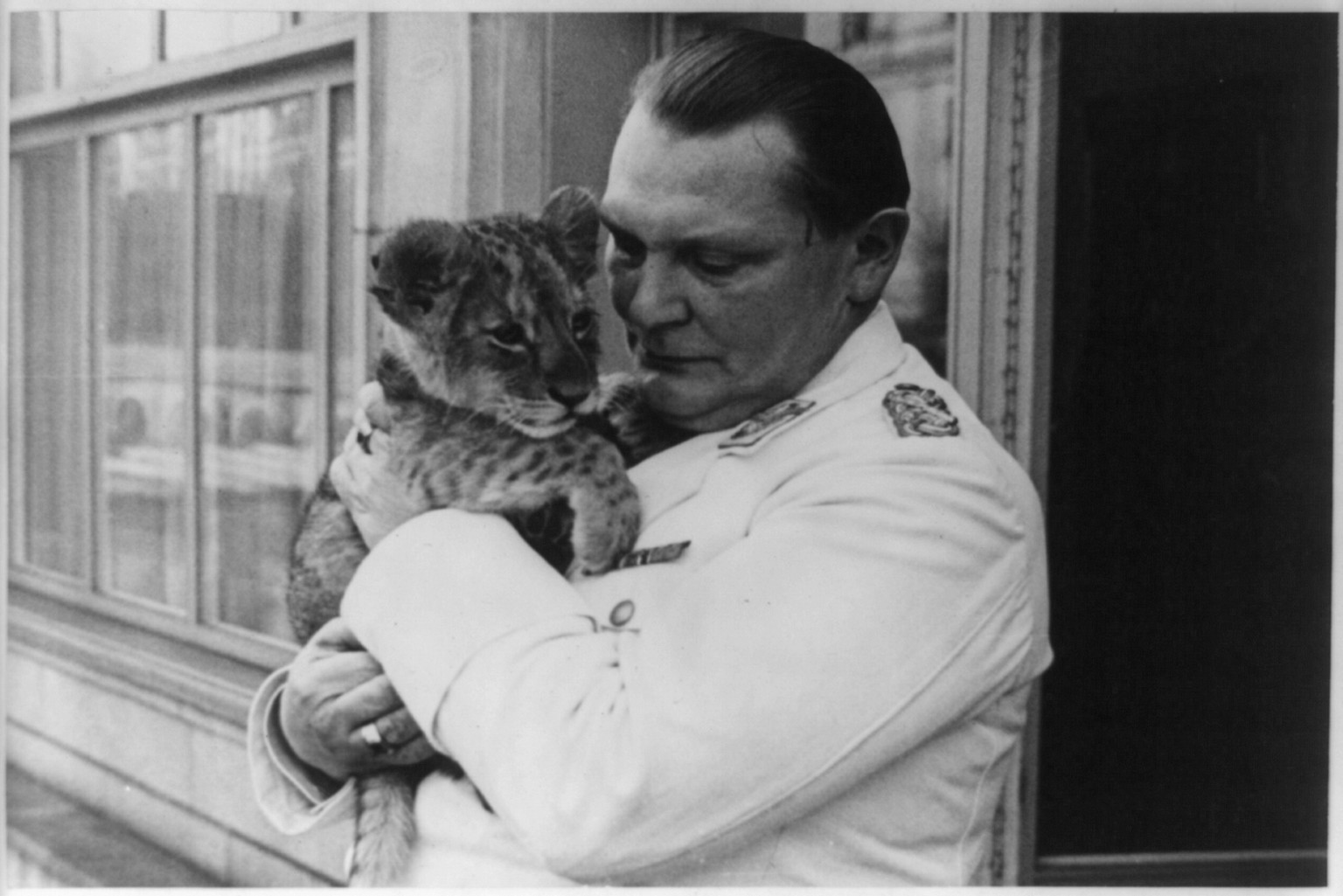 [Goering and lion cub], [1938 February 7] — historic photograph