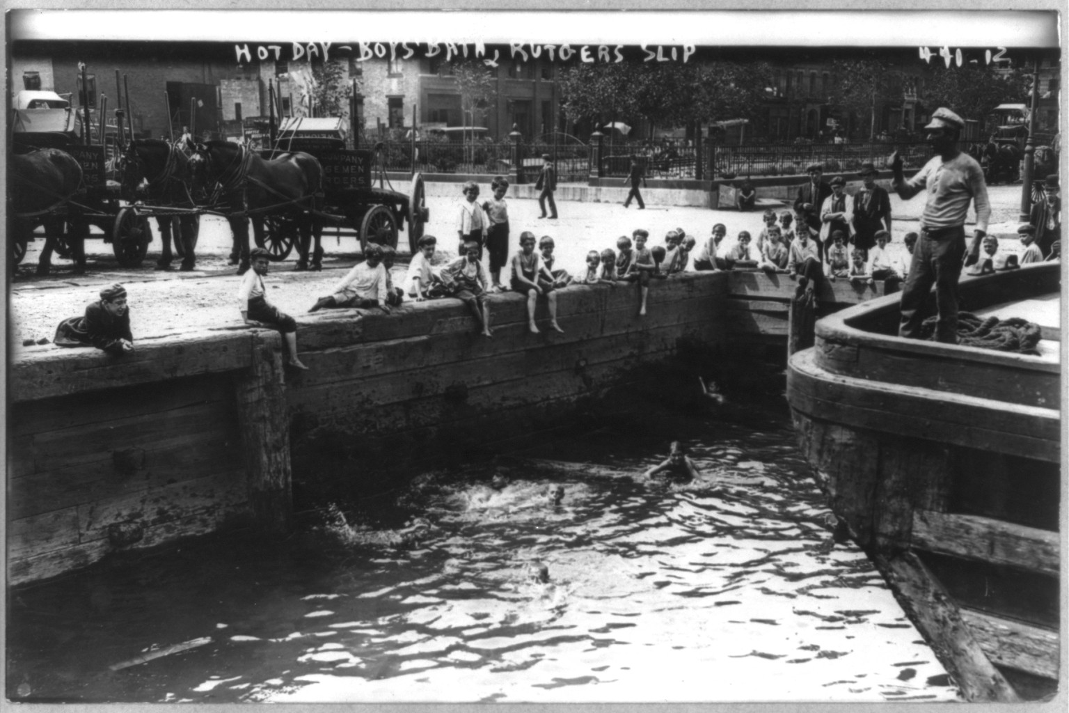 New York City. Boys swimming at dock. Rutgers Slip, ca. 1908, ca. 1908. — historic photograph