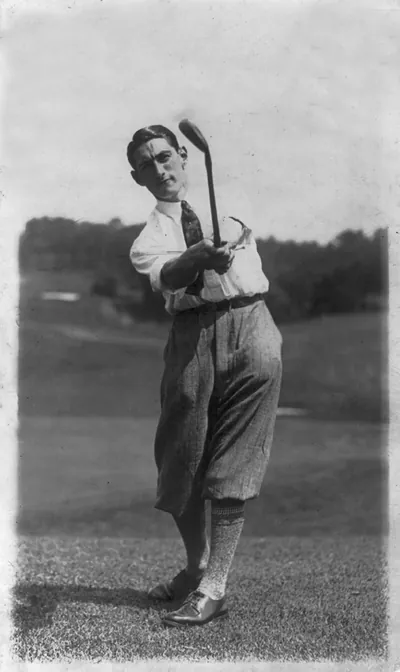 Tom Amour following through on golf swing
