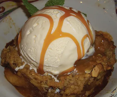 Apple crumble with ice cream and caramel sauce