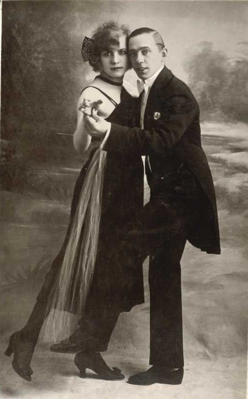 Vintage sepia studio photograph of a dancing couple — historic photograph