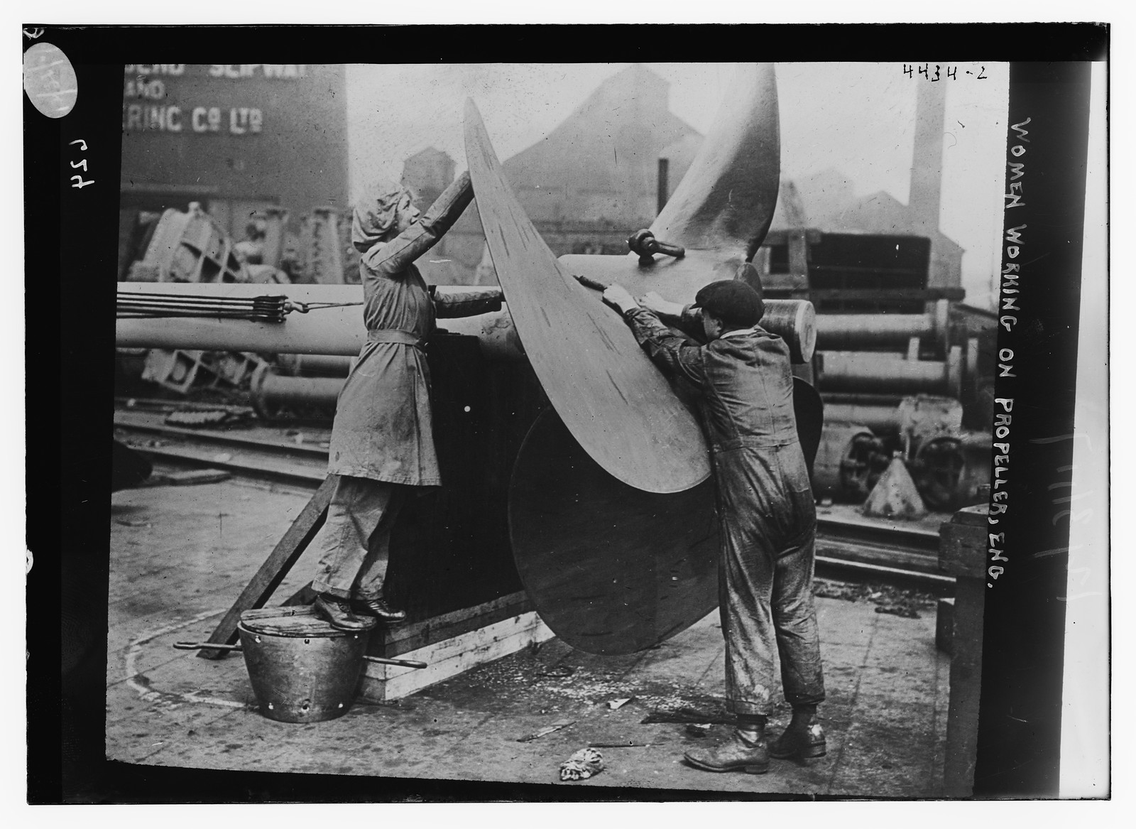 Women working on plane prop, Engl., n/a — historic photograph