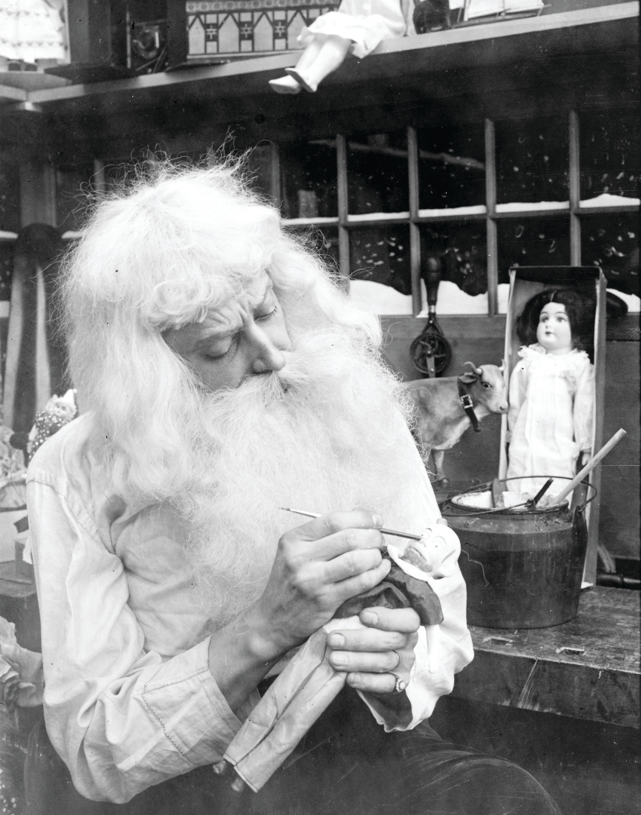 [Santa Claus" making a toy]", c1907. — historic photograph