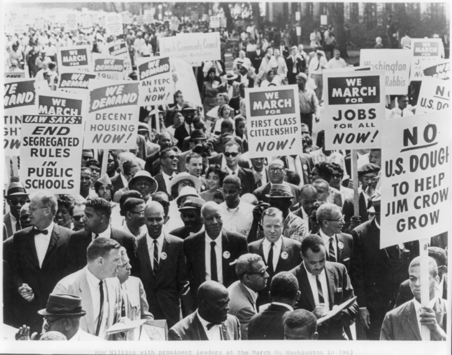 [Roy Wilkins with a few of the 250,000 participants on the Mall heading for the Lincoln Memorial in the NAACP march on Washington on August 28, 1963], 1963 August 28. — historic photograph