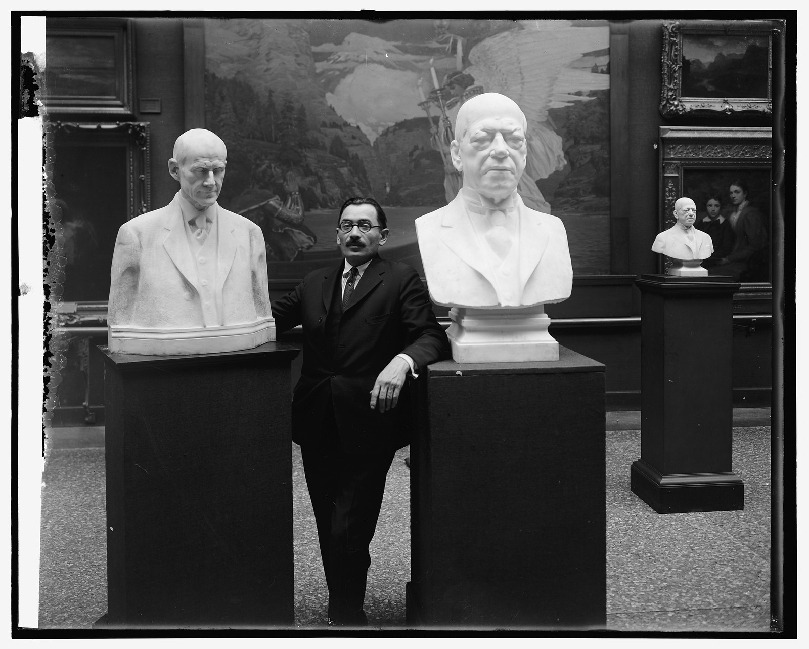 Dykaar with busts of Pres. at National Gallery, [Washington, D.C.], [between 1910 and 1926] — historic photograph
