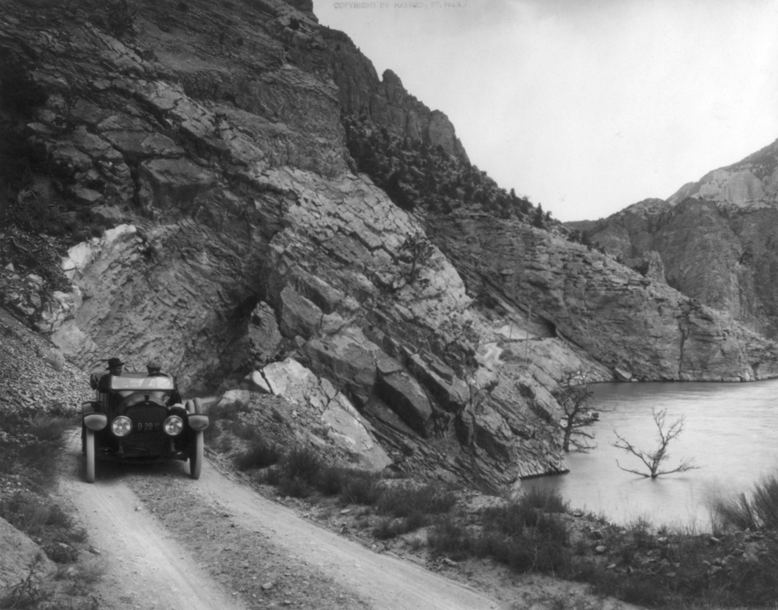 Yellowstone National Park: Auto above Shoshone dam, c1917. — historic photograph