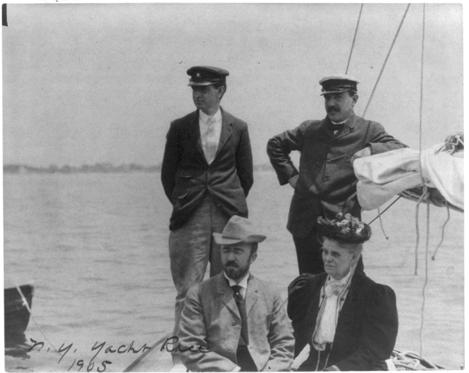 [New York Yacht Club, Oyster Bay, L.I., 1905: 2 men with man and woman watching yacht race], 1905 — historic photograph