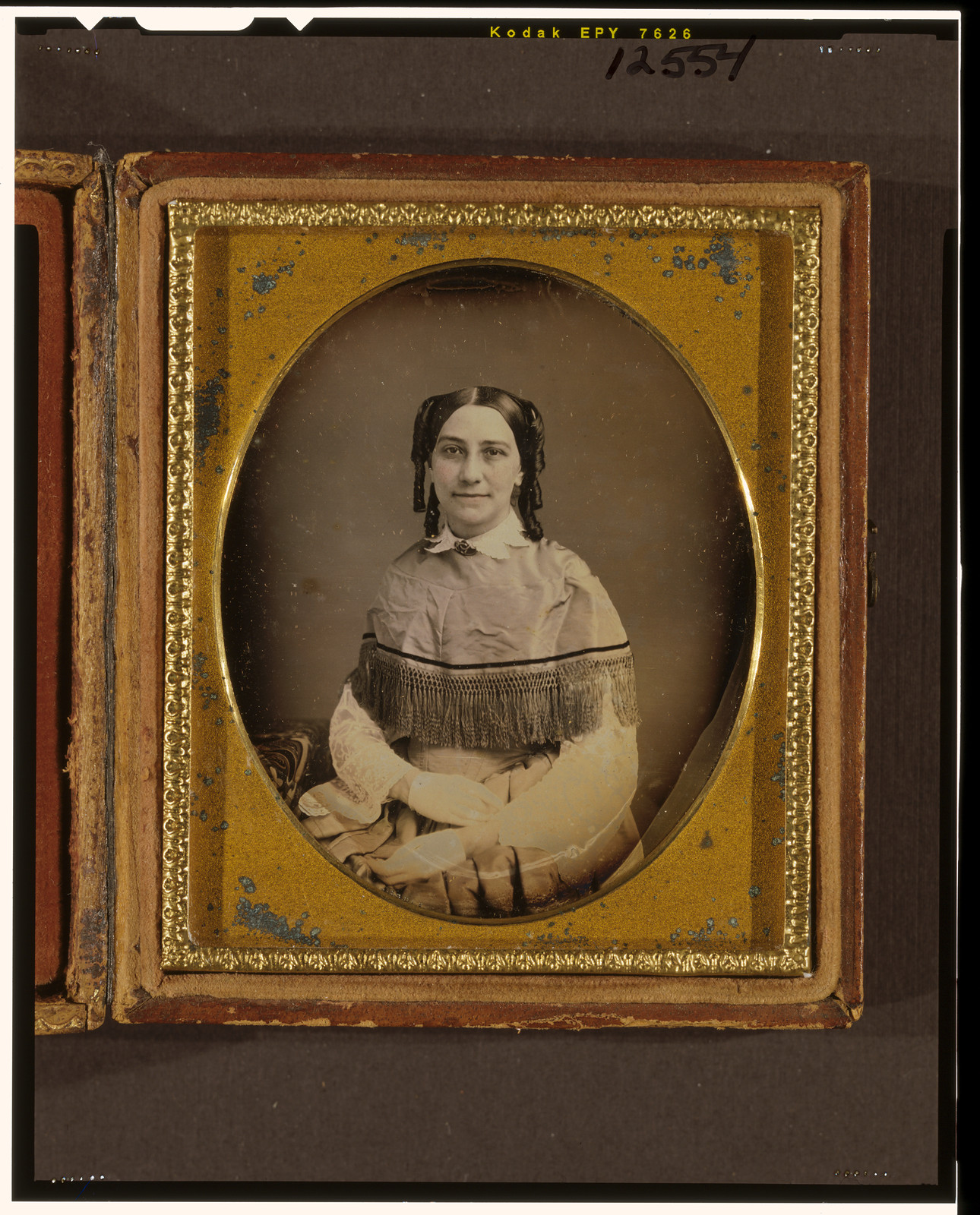 Seated woman in hand-colored daguerreotype, gilt mat and case, 1840 — historic photograph