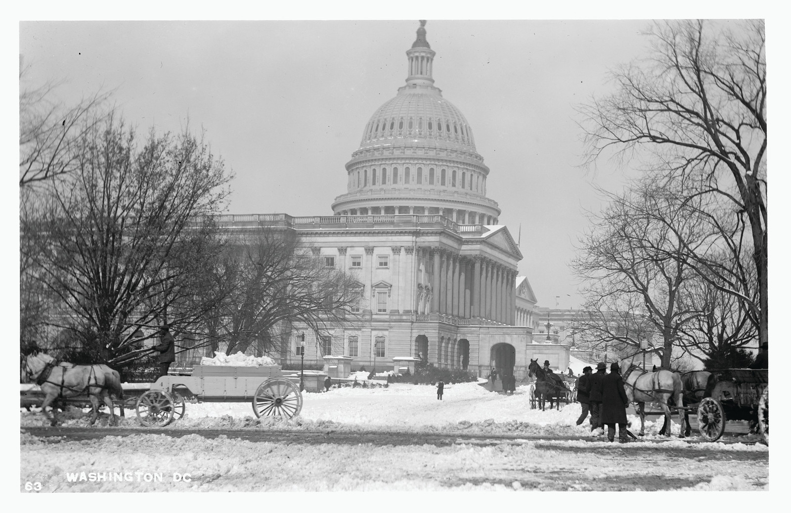 Snowy Capitol dome with horse-drawn sleighs and wagons — historic image
