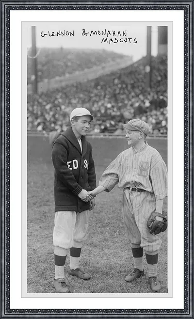 Glennon and Monahan mascots shaking hands at ballpark