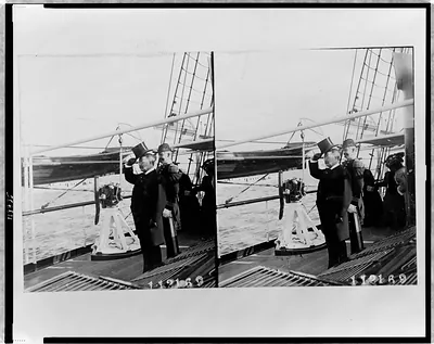 [Theodore Roosevelt, full-length portrait, facing left, standing on deck of ship, with a naval officer]