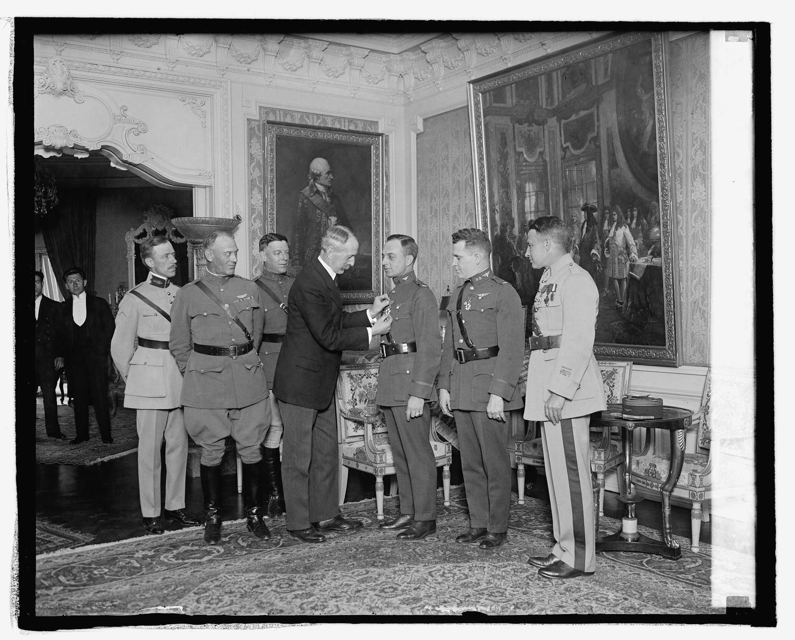 Ambassador Daeschner decorating world flyers, 5/7/25, [19]25 May 7. — historic photograph