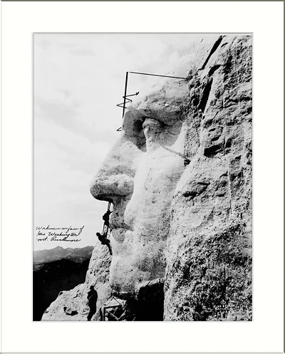 Workmen on face of Geo. Washington, Mt. Rushmore