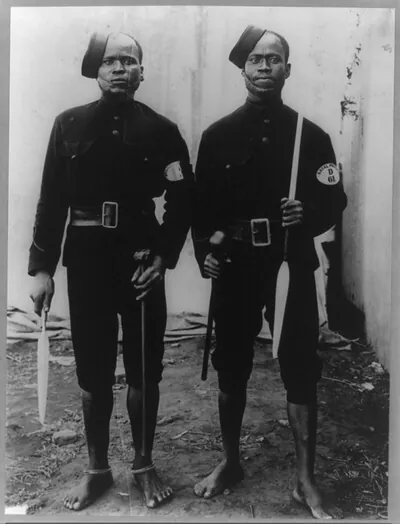 [2 barefooted policemen posed full lgth., Capetown, South Africa]
