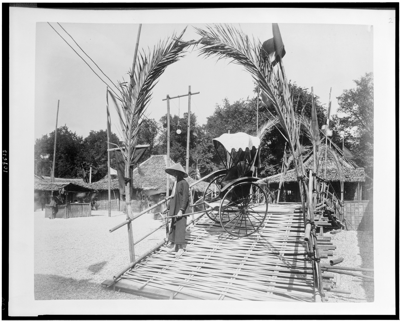 [Man posed with pousse-pousse in Tonkin Village, Paris Exposition, 1889], [1889] — historic photograph